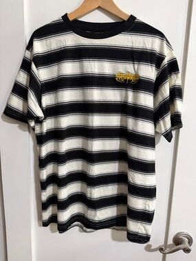Striped Black and White Short Sleeve Tee with Yellow Chest Emblem